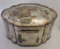 A late 19th Century Silver on Copper Canister, of lobed oval form with hinged cover centred with a