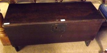 A 17th Century Dark Oak Coffer or Sword Chest, plain top with moulded front edge, void interior,