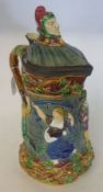 A Minton Majolica Ewer with pewter mounted rim and lid, decorated with whimsical storybook figures