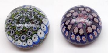 A 20th Century Paperweight inset with a millefiori scramble design on a predominantly green carpet