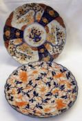 Two Japanese Imari circular Plates each with crimped rims, one decorated with a compartmentalised