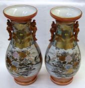A pair of Kutani baluster Vases of two handled spreading circular form, painted in colours with
