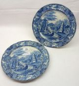 A pair of early 19th Century English blue printed Plates, the centres decorated with Chinese river