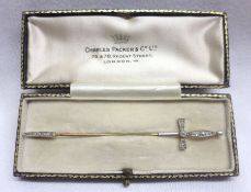 An attractive early 20th Century Stick Pin, in the form of a sword with small old cut Diamonds to