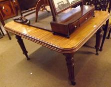 A Victorian Mahogany Wind-Out Extending Dining Table, with moulded edge, raised on ring turned and