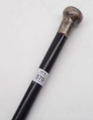 An Ebonised Walking Cane with hallmarked Silver button handle, 36” long