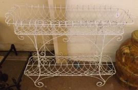 A white painted wirework Two Tier Planter of rectangular form, raised on scroll feet, circa late