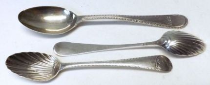 A pair of early Georgian base marked Teaspoons with feathered handles and shell bowls, (marks