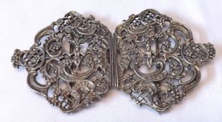 A good quality Elizabeth II Nurses two-part Belt Buckle, pierced with putti on swing within a