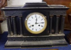 A last quarter of the 19th Century large Black Slate Cased Mantel Clock with colonnaded front and