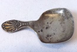 A George V Caddy Spoon with shaped rectangular bowl and shell handle, 2 ½” long, Sheffield 1931,