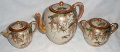 A Satsuma Tea Service, comprising a Cylindrical Covered Teapot, Sugar Bowl and Cream Jug, all