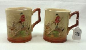 A pair of Royal Doulton Mugs, embossed and decorated in colours with fox-hunting scenes, 4” high