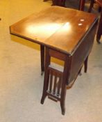 An Edwardian Mahogany Sutherland Table, crossbanded and box wood and ebonised strung top with canted