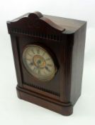 An early 20th Century German Stained Wooden Cased Mantel Clock, the composition dial with Roman