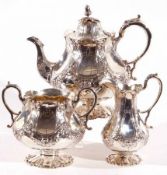A good Victorian large three piece Tea Set of panelled circular form, heavily chased and embossed
