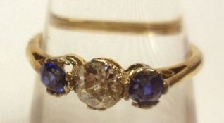 An early 20th Century high grade precious metal centre old cut Diamond and two mid blue Sapphire