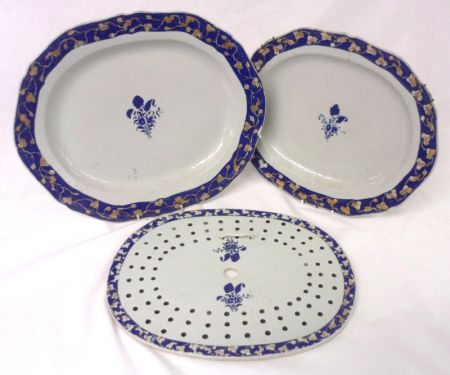 An Oriental Export Part Dinner Service, the borders all gilded with foliage on blue reserves and the