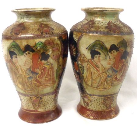 A pair of modern Oriental Baluster Vases, decorated with figures and foliage, 8” high