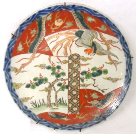 An Imari Circular Plate, painted in iron red, famille verte etc with exotic birds and other