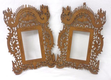 A pair of Eastern Treen Picture/Photograph Frames, each ornately carved with exotic birds and