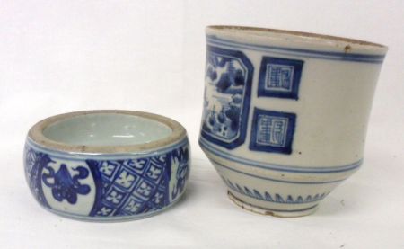 An Oriental Cylindrical Brush Pot, with a tapering base, painted in underglaze blue with panel of