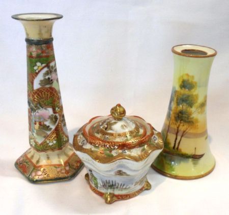 A Noritake Candlestick, decorated with panels of pagodas with iron red and gilded detail; a