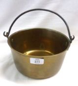 A Brass Circular Jam Pan with a looped cast metal handle, 8” diameter