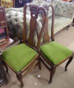 A pair of European Oak Dining Chairs, with scroll moulded uprights and vase-shaped splay backs,