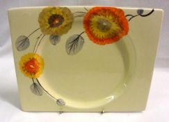 A Clarice Cliff Biarritz Plate, decorated with a shoulder pattern only (Tresco) on a honey glaze