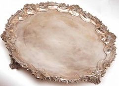 A George III Salver, of shaped circular form with cast and applied rim to a polished field (erased),
