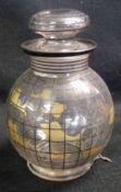 A 20th Century Glass Covered Jar of baluster form, gilded with swimming fish and with grey