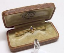 An early 20th Century 15ct Gold Bar Brooch, of pierced rectangular design, a centre diamond-shaped