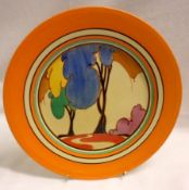 A Clarice Cliff Circular Plate, decorated with the “Blue Autumn” design, within an orange banded
