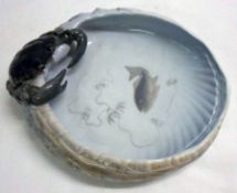 A Royal Copenhagen shell-shaped Bowl of oval form, decorated with motif of a crab, and the centre