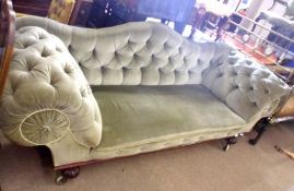 An early 19th Century Mahogany Large Sofa with green draylon upholstered button back, heavy scrolled