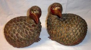 A pair of Oriental carved and painted Treen Models of Game Birds, (one with missing claws on