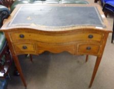 An Edwardian Satinwood Small Writing Table, of rectangular form with a serpentined front, the top