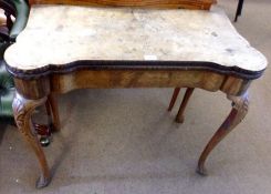 An 18th Century Bleached Walnut Fold Top Card Table of shaped rectangular form, with plain frieze