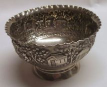 A late 19th Century white metal Sugar Bowl, of circular form with crimped rim and body embossed with