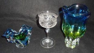 A set of five Edwardian Engraved Wine Glasses, decorated with floral garlands, raised on star-cut