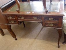 A 20th Century Mahogany Desk with a green gilt tooled leather inset, the frieze with central