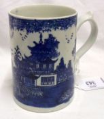 A late 18th/early 19th Century English Tankard, decorated in underglaze blue with a Chinese river