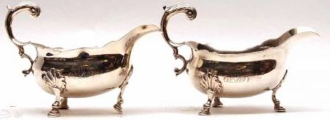 Two George II Gravy Boats, each of typical polished form with cut card rims, cast and applied