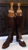 An early 20th Century pair of Gents Knee Length Brown Leather Hunting Boots, complete with trees