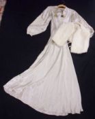 A 1930s Cream Satin Wedding Dress with long embroidered sleeves; together with a White Fur Cape