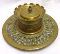 A late 19th Century Cast Brass Inkstand, the pierced and foliate circular base on three bun feet, to
