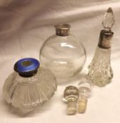 A Mixed Lot comprising: three various Silver mounted and Clear Cut Glass Toiletry Bottles, each with