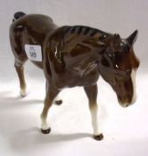 A Beswick type China Model of a horse, impressed on one leg with No 3176 (ear chipped), 7” high