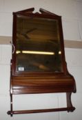 A late 19th/early 20th Century Mahogany Wall Mounting Towel Rail, crested with a mirror and